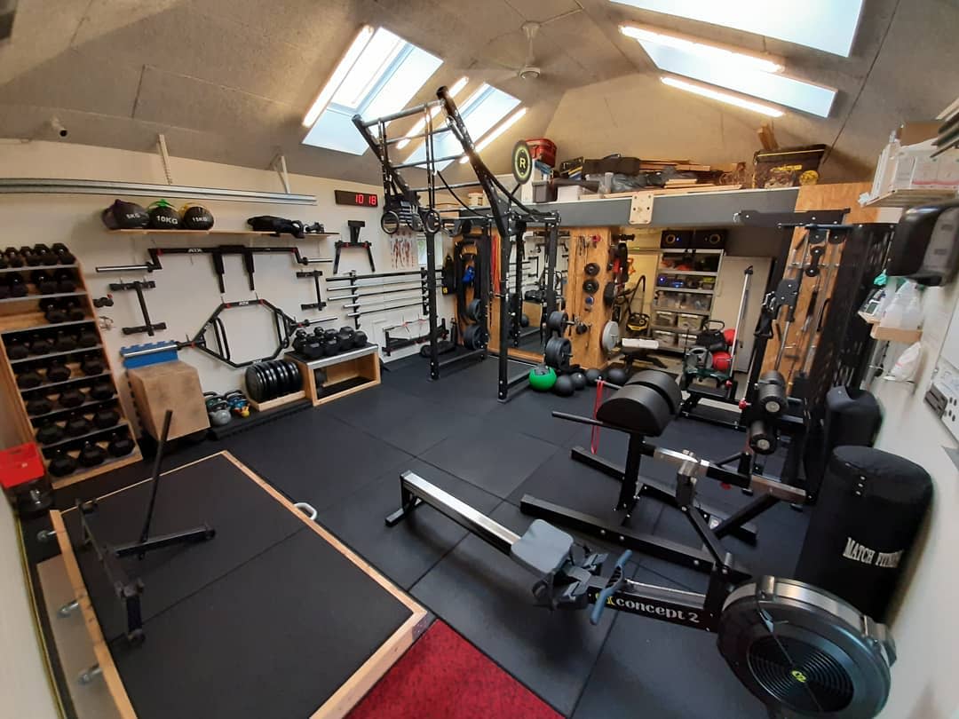 garage home gym conversion free weights benchpress floor mats